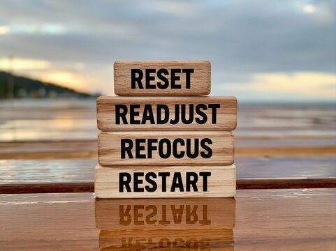 Reset readjust refocus and restart wooden blocks for personal growth and success