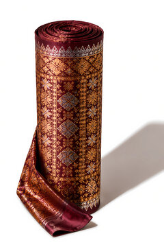 Rolled Traditional Indonesian Songket Fabric with Gold and Silver Thread Motif