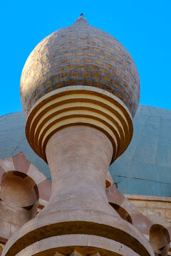 Unique spherical dome top and decorative architectural elements against blue sky