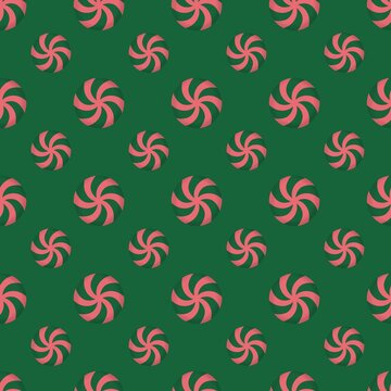 Christmas seamless pattern with peppermint candy swirls on green background