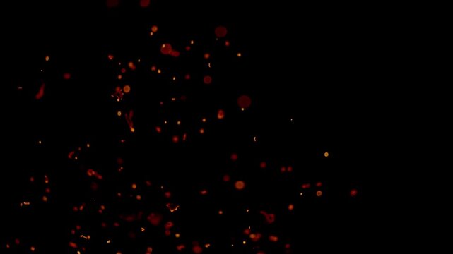 Sparks flew, coals ignited in the flames. Abstract glowing flame and smoke particles on black background, campfire flame burning