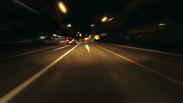 Cinematic night-time timelapse of a fast drive through a modern city, with glowing neon lights