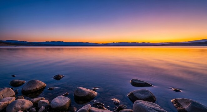 Tranquil lake sunset landscape