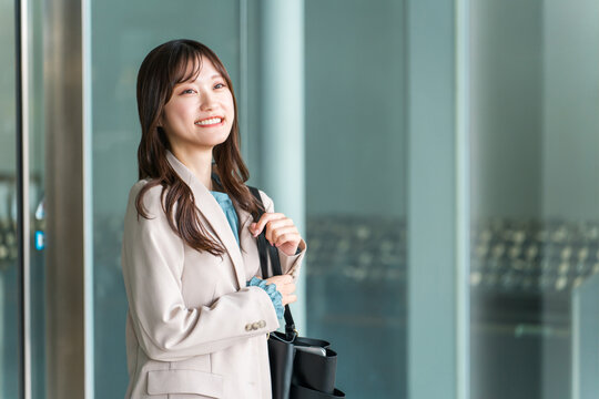 Businesswomen who commute to work, go to the office, or travel for business.