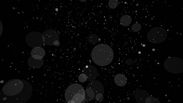 Monochrome particle floating overlay featuring subtle glowing bokeh spheres and floating white dust motes moving slowly across a deep black background creating a dark serene atmosphere