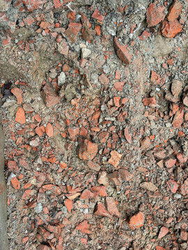 Pile Of Broken Red Bricks And Rubble On The Ground