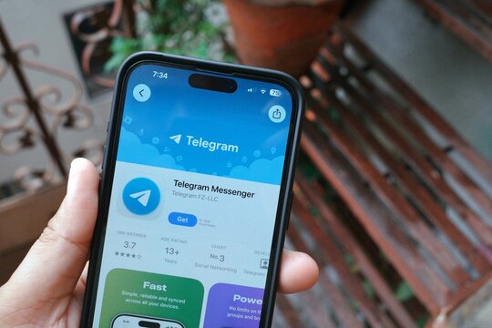 Delhi, India August 2026 : Telegram app on smartphone, Telegram is a secure, fast, cloud-based messaging app that works across all devices. It supports massive group chats, large file sharing.