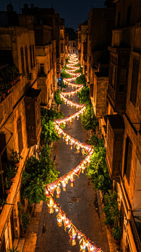 Elevated Perspective of Winding Street Decorated with Ramadan Lanterns at Night