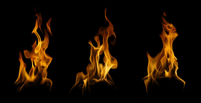 Set of three realistic fire flames and burning tongues isolated on black background. Collection of abstract blaze shapes for cinematic special effects and design overlays.