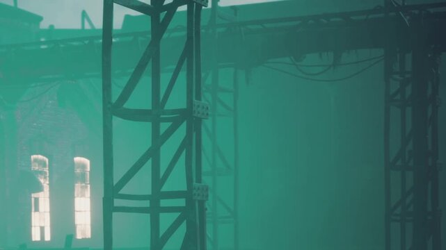 A tall metal structure stands in a foggy industrial area filled with green light. Wires and pipes are visible in the background, creating a shadowy atmosphere. The scene appears quiet.