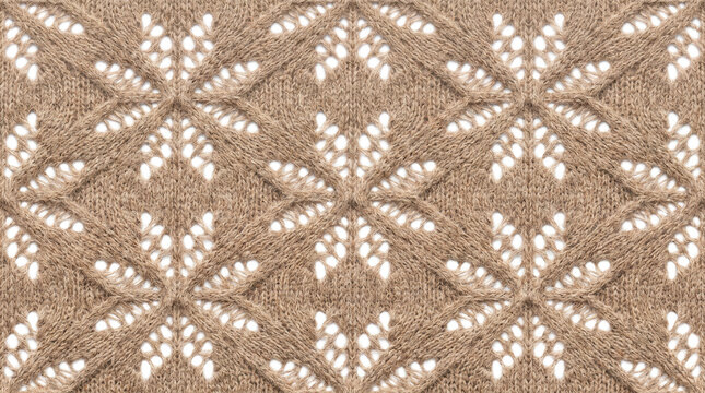 Cozy knitted fabric with openwork snowflake pattern in warm neutral tones and soft overhead lighting