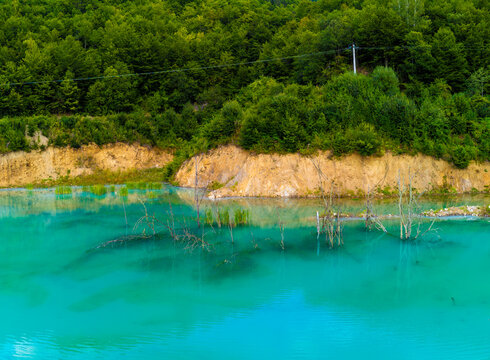 Landscape with artificial tailings pond at Geamana Flooded Village in the Apuseni Mountains of Alba County, Romania, dumping ground for toxic waste from the nearby Rosia Poieni copper mine