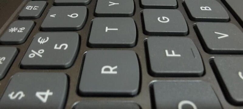 Close up view of black computer keyboard keys showing letters Q W E A S D