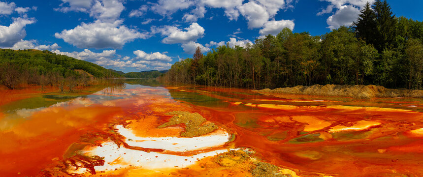 Landscape with artificial tailings pond at Geamana Flooded Village in the Apuseni Mountains of Alba County, Romania, dumping ground for toxic waste from the nearby Rosia Poieni copper mine