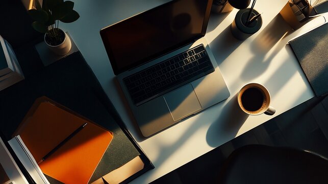 Overhead view of a modern workspace with laptop and coffee break