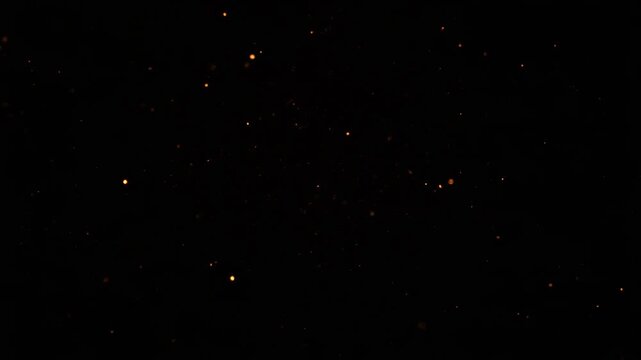 Small glowing orange particles scattered against a black background