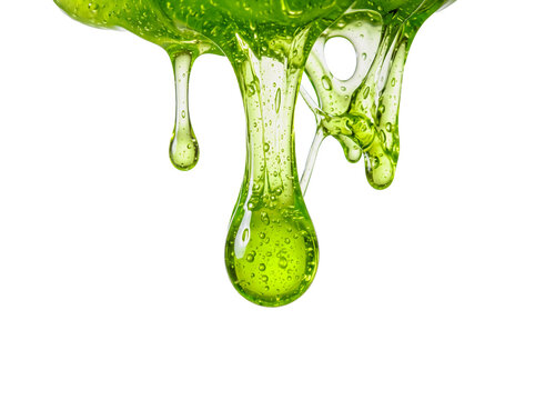 Dripping green liquid slime macro isolated on white background