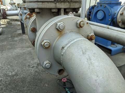 Close-up of Industrial Steel Pipe Flange with Bolts in Oil or Chemical Refinery Facility