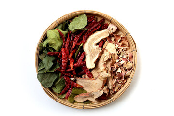 Naklejka premium Collection of dried Tom Yum herbs including galangal, lemongrass, chili, and kaffir lime leaves. Traditional Thai food ingredients