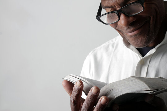 A serene portrait of a man praying with hands together in deep prayer that perfectly captures themes of faith, hope, mindfulness, and inner peace stock image stock photo