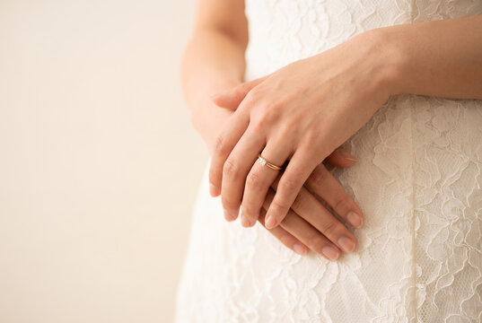 Bride showing diamond engagement ring on wedding day close-up portrait