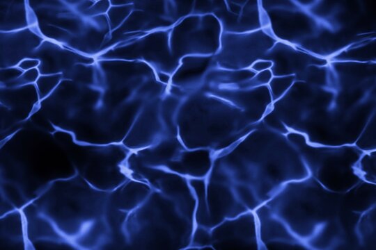 Abstract dark blue water surface with glowing light reflection and ripples pattern