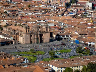 Aerial view of the historic Plaza de Armas and the Cusco Cathedral surrounded by colonial architecture in Cusco © marchello74