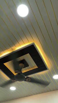 Completed modern slatted false ceiling with ambient LED cove lighting and ceiling fan