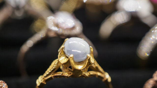 Vintage gold jewelry blue sapphire rings show in luxury retail store display showcase