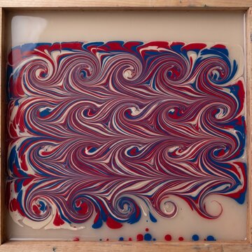 Combed pigment held on the surface of a paper marbling trough