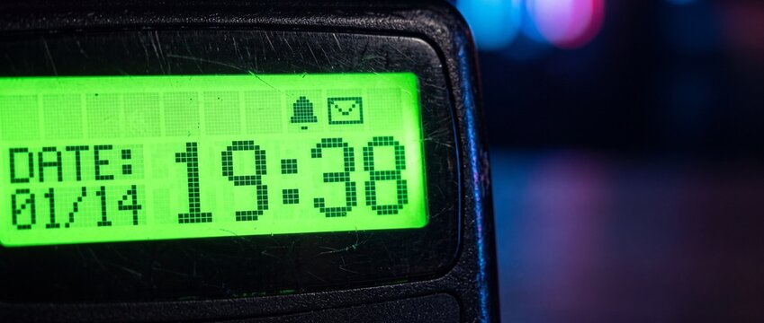 Digital pager screen display showing time nineteen thirty eight and current date january fourteen for vintage communication usage.