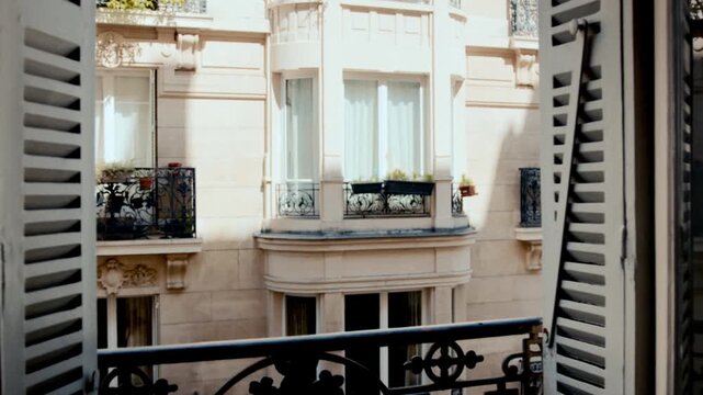 Parisian apartment building window view revealing haussmannian architecture