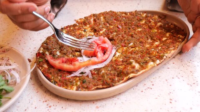 Traditional Turkish Lahmacun Flatbread Topped With Spiced Minced Meat, Tomato and Onion Slices