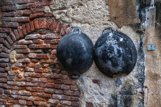 Rust pan hanging on the wall in talad noi.Talad Noi (Talat Noi), one of the oldest neighbourhoods in Bangkok, Thailand