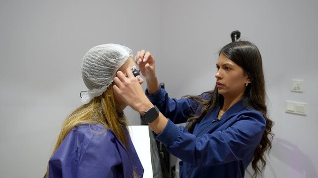 Beautician performing eyelash lamination and lifting procedure
