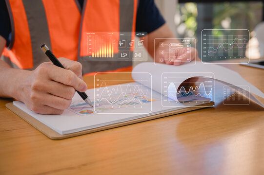 Foreman or engineer using pen and clipboard data charts working at construction site Quality control, maintenance, check in factory, warehouse Workshop for factory operators