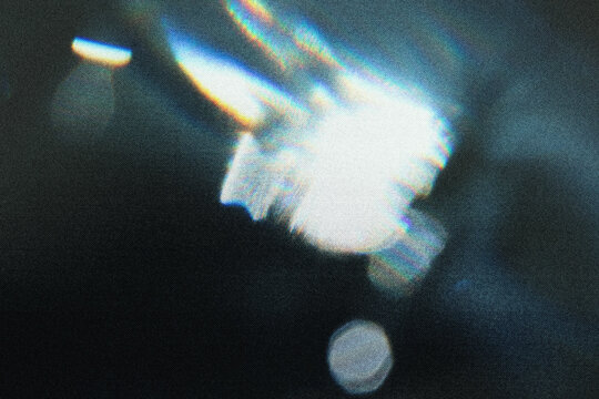 Beautiful light leak on dark background with Real lens flare.