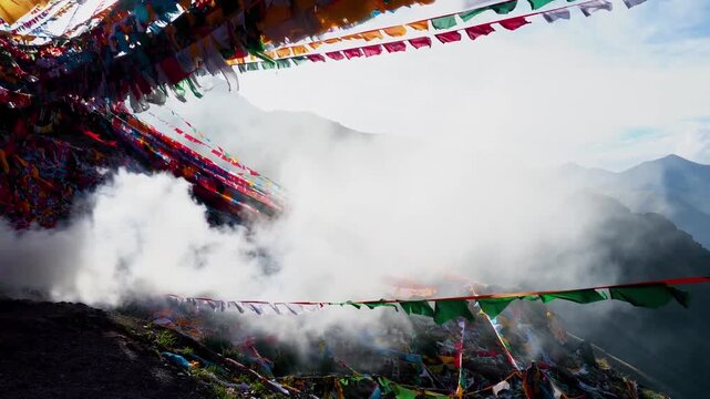 Tibetan prayer flags and incense smoke over mountain valley, sacred highland religious scenery, Sichuan China