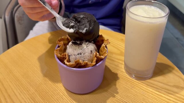 Close Up of Ice Cream Scoop in Bowl with Hand Holding Spoon ,Sweet Dessert