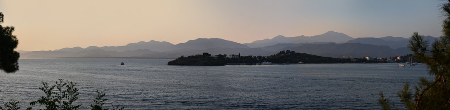 Panoramic landscape with a sea bay under a soft evening sky. Fethiye, Turkey