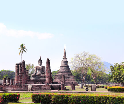 Ancient stone Buddha statue, Wat Sa Si temple, Sukhothai historical park. Picturesque scene with Buddha statuary, Sukhothai old city, Northern Thailand. Topic of vacation, travel, trip, cruise, tour