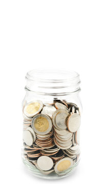 Glass jar full of Thai baht coins. Business and finance concept. Vertical Photography.
