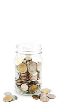 Glass jar full of Thai baht coins. Business and finance concept. Vertical Photography.