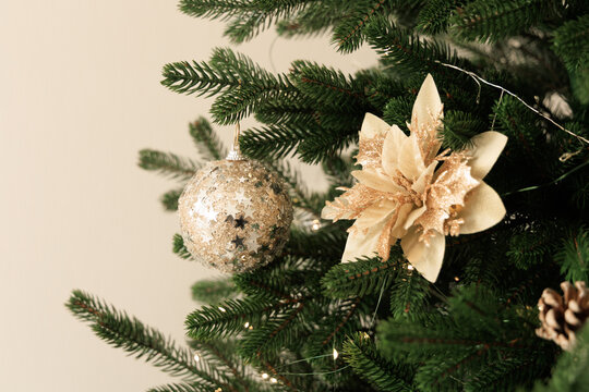 Christmas tree decorations with golden flower and sparkling ornament