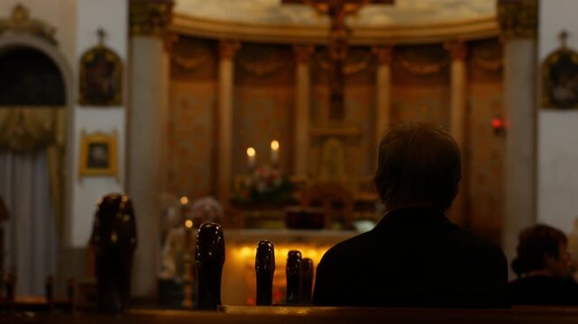 Person Praying in Church Interior Silhouette, Candlelit Altar with Virgin Mary Statue