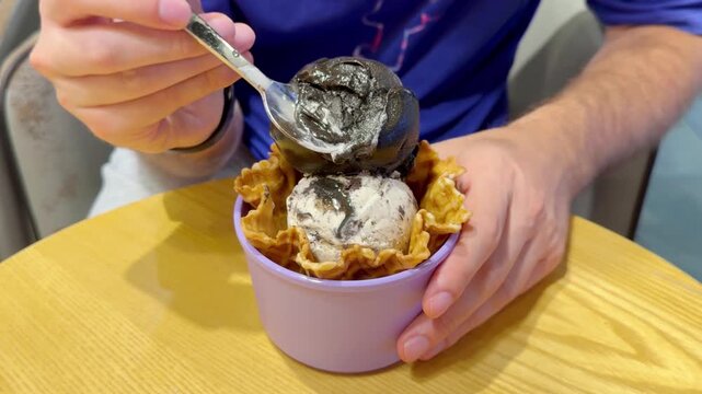 Close Up of Ice Cream Scoop in Bowl with Hand Holding Spoon ,Sweet Dessert