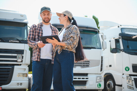 Truck drivers using digital tablet for fleet management