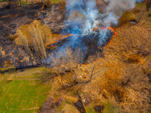Aerial View of Wildfire Spreading Through Dry Grassland
