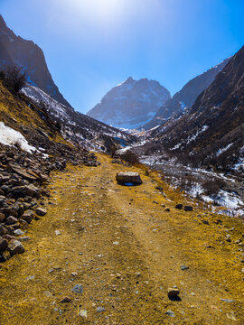 Dirt Path Leading into Rugged Mountain Valley in Kyrgyzstan
