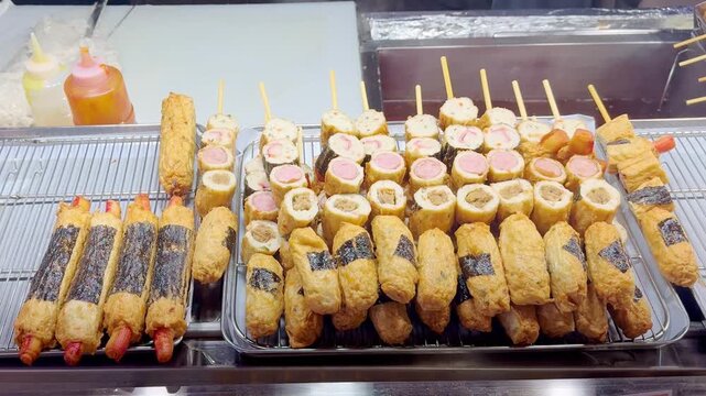 Korean Street Food &ndash; Assorted Corn Dogs with Potato Coating, Mozzarella Cheese and Sausage Fillings at Night Market Stall